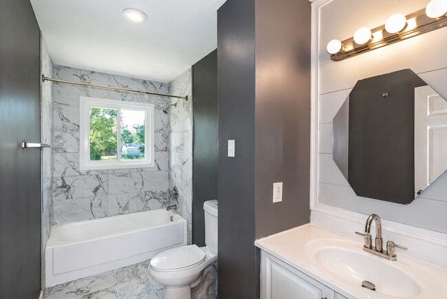 Building Photo - This charming 5-bedroom, 2-bathroom home is available for $2,000/month.