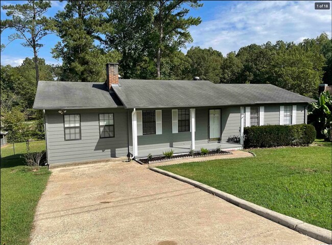Beautiful front porch and garden will welcome you home - 714 Woodland Dr S