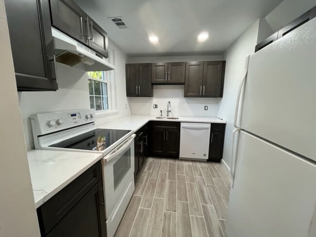 Building Photo - This residence showcases a beautifully upd...