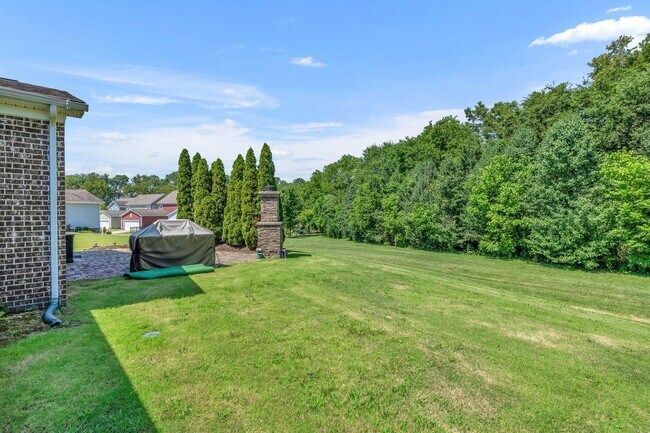 Building Photo - Beautifully maintained and move-in ready, this stunning mostly one-level all-brick home