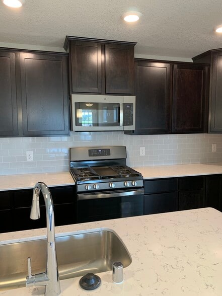 GE Slate appliances in kitchen - 4825 Martingale Drive