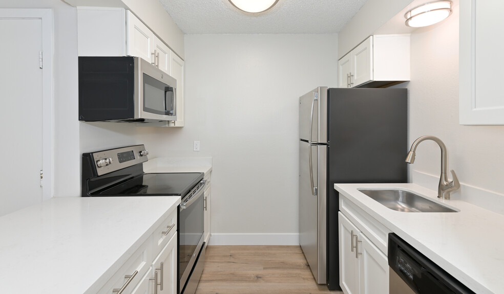 Kitchens features stainless steel appliances and updated cabinetry - Creekside