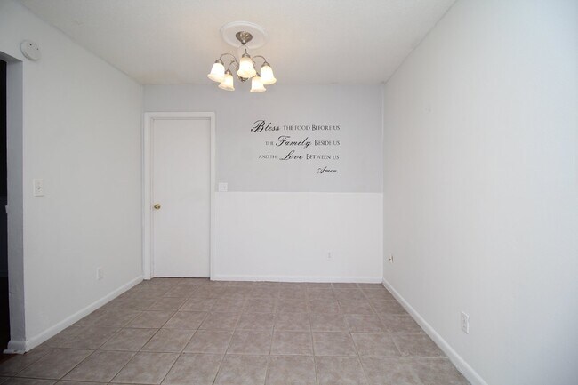 Building Photo - Spacious 3BR/1.5BA Home in Pace with Open Living Area, Tiled Family Room, and Fenced Backyard – M...