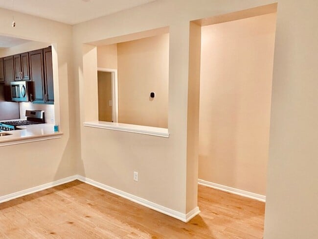 Building Photo - Willow Wood community features a brick ele...