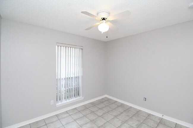 Building Photo - West Pensacola Brick Home with Vaulted Ceilings, Split Floor Plan, Open Living Design & Easy Acce...
