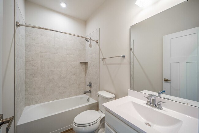 Building Photo - This 3-bedroom, 3-full bathroom townhouse offers a pristine and contemporary living experience.