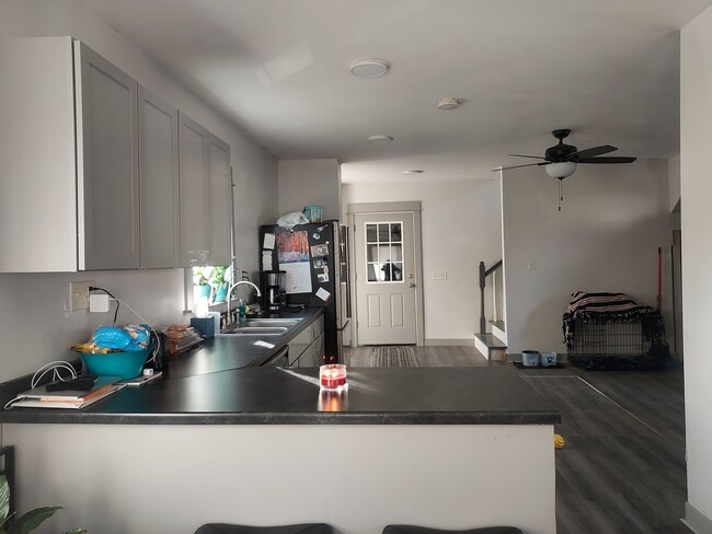 Kitchen view to garage door and stairs - 615 Lawn Dr