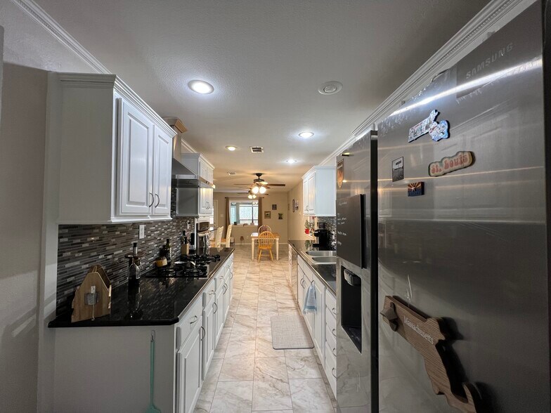 Alley kitchen with new Samsung fridge - 3920 Sanguinet St