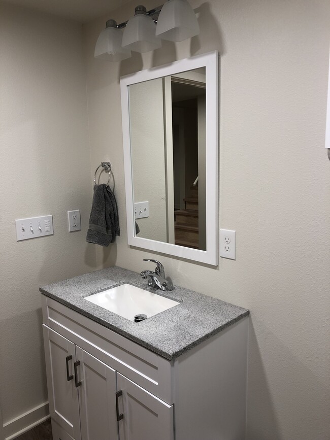 New vanity, large mirror, and electronic fan timer. - 4842 NE Mallory Ave