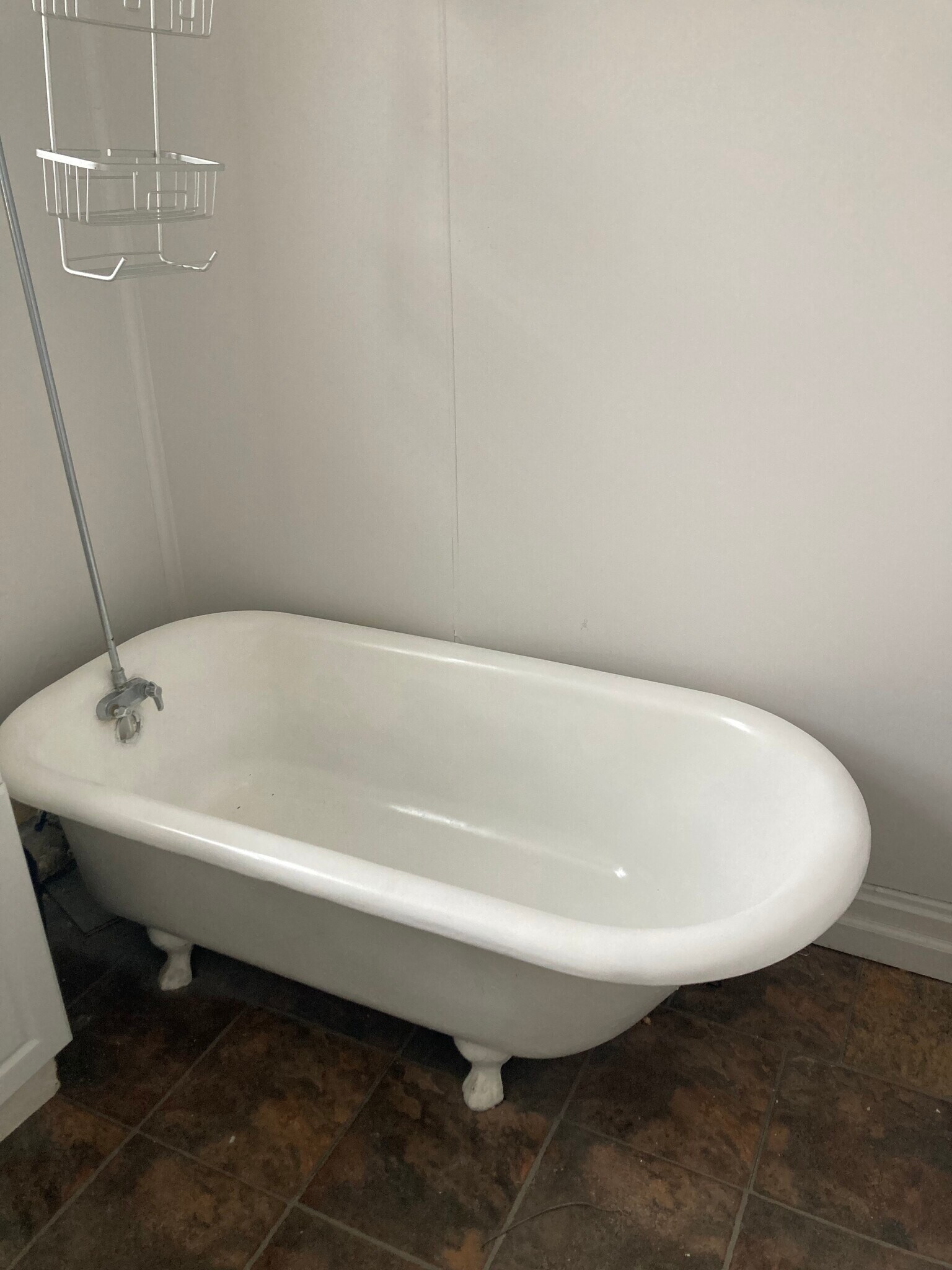 Antique claw tub perfect for long baths - 406 Grace St