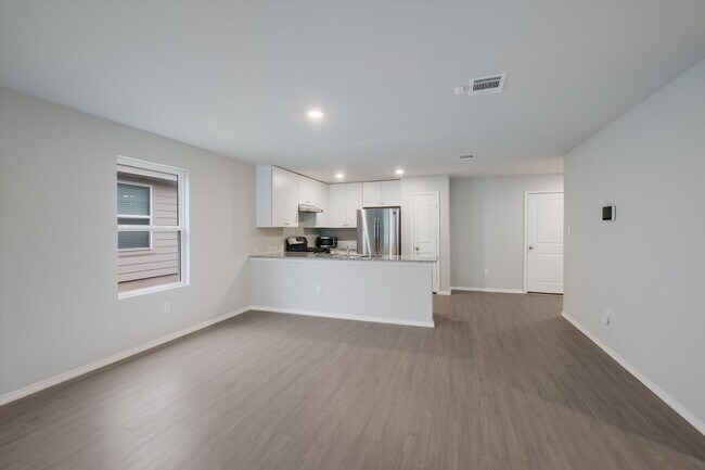 Building Photo - Open-Concept Living with New Flooring