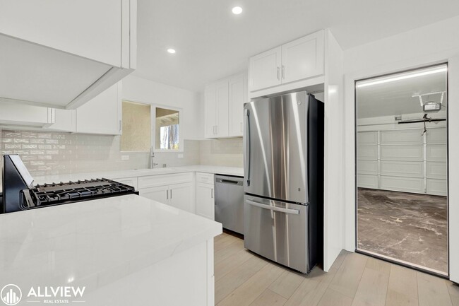 Building Photo - Fully Renovated 4-Bedroom Home with Firepl...