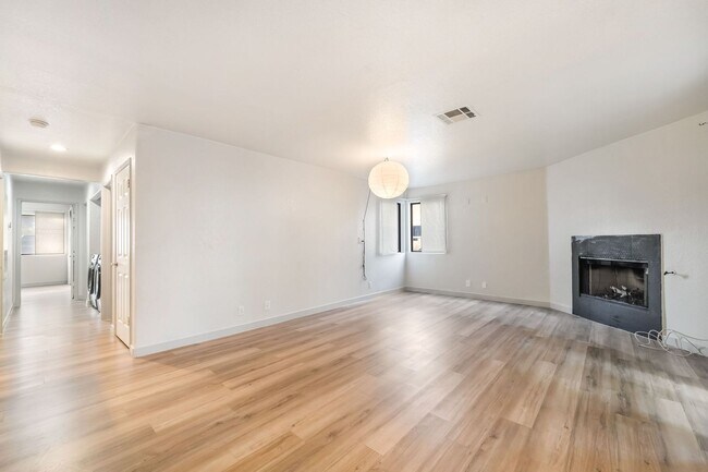 Building Photo - Upgraded Three-Bedroom Condo with Wood Flooring and Modern Comforts!