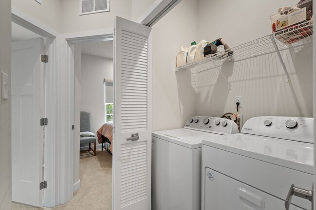 Building Photo - Luxurious three-story townhome with owner's suite and high-end finishes