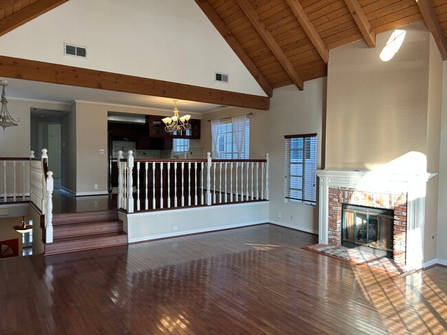Living room with balcony and dining area up the stairs and next to the kitchen - 1713 Goodman Ave