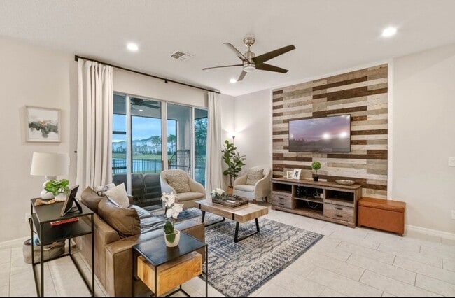 Building Photo - Water Front Home- 4 Large Bedrooms-3 baths Gated Community Call Sheila Campbell 407-687-7900