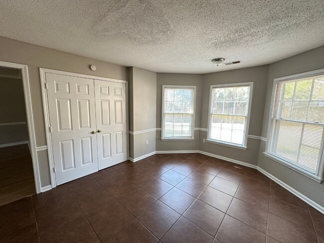 Building Photo - Charming 3BR/2BA Near Southwind | Hardwood Floors, Brick Fireplace, Bay Window & 2-Car Garage