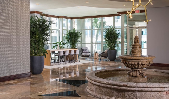 Beautifully updated lobby with work station - Yacht Club Apartments