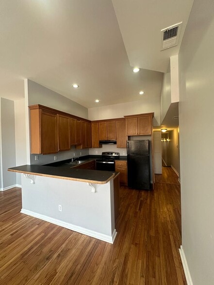 View of the kitchen. Kitchen is well lit with LED recessed lights, GE appliances and hardwood floors - 1426 Madison Ave