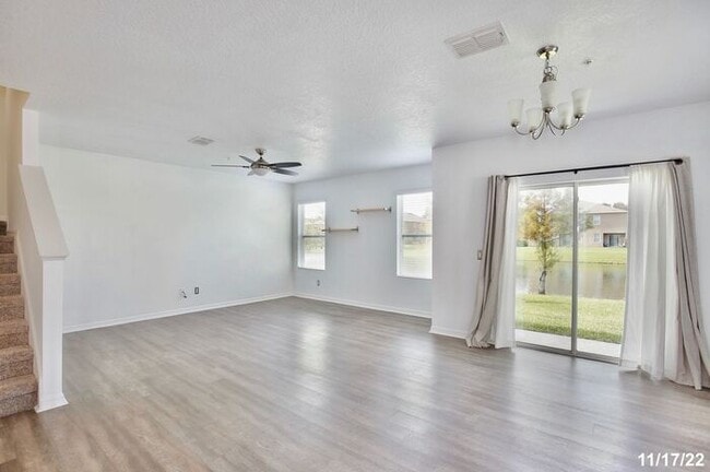Building Photo - Spacious 3/2.5 Townhome with a 2 Car Garage and a Beautiful Pond View in Westwood Condos - Orlando!