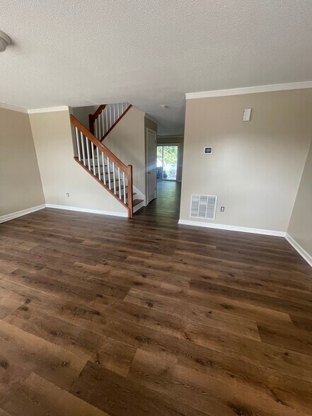 Living room with new LVP flooring - 1419 Founders Way