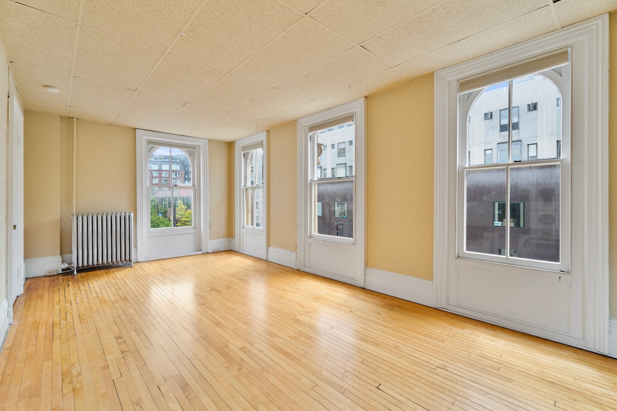Light filled East and South Facing 1100 s.f 2 bedroom, 1 bath with natural rock maple floors - 102 N Tioga St