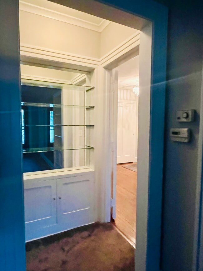 Hallway with built-in bookshelves - 115 E Monroe St