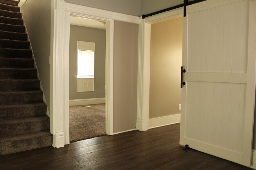 View of laundry room and master bedroom from living area - 441 Crosby St NW
