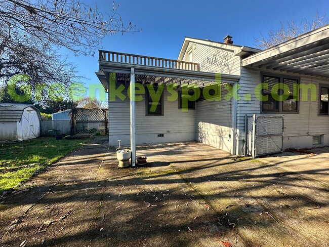 Building Photo - Huge, fenced back yard! Garage! Nice bonus...