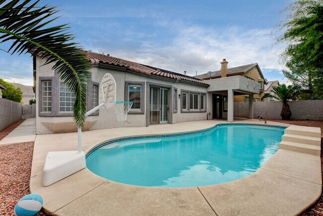 Building Photo - 4 bedroom, 3-bath home with a Pool!