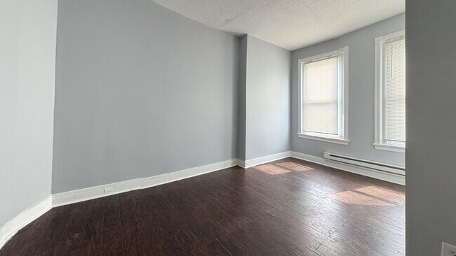 Building Photo - Updated 3 Bedroom 1.5 Bath Townhome w/ Paved Yard + Washer & Dryer