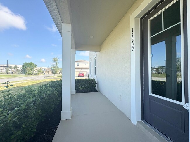 Building Photo - Newly Built, Water View, Luxury Executive 3 BR Lake Nona area corner townhome with an exclusive l...