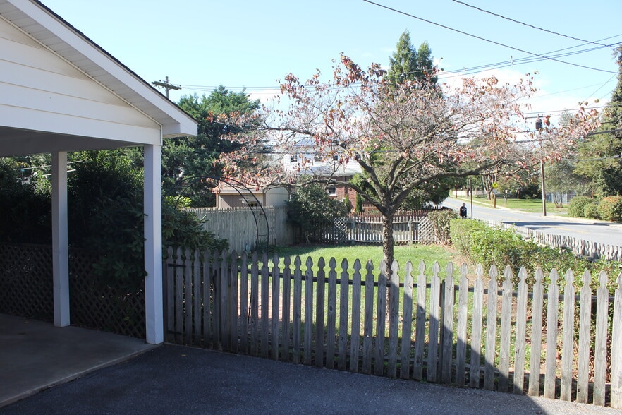 Car port and large, fenced backyard just outside the kitchen door. - 925 North Market Street