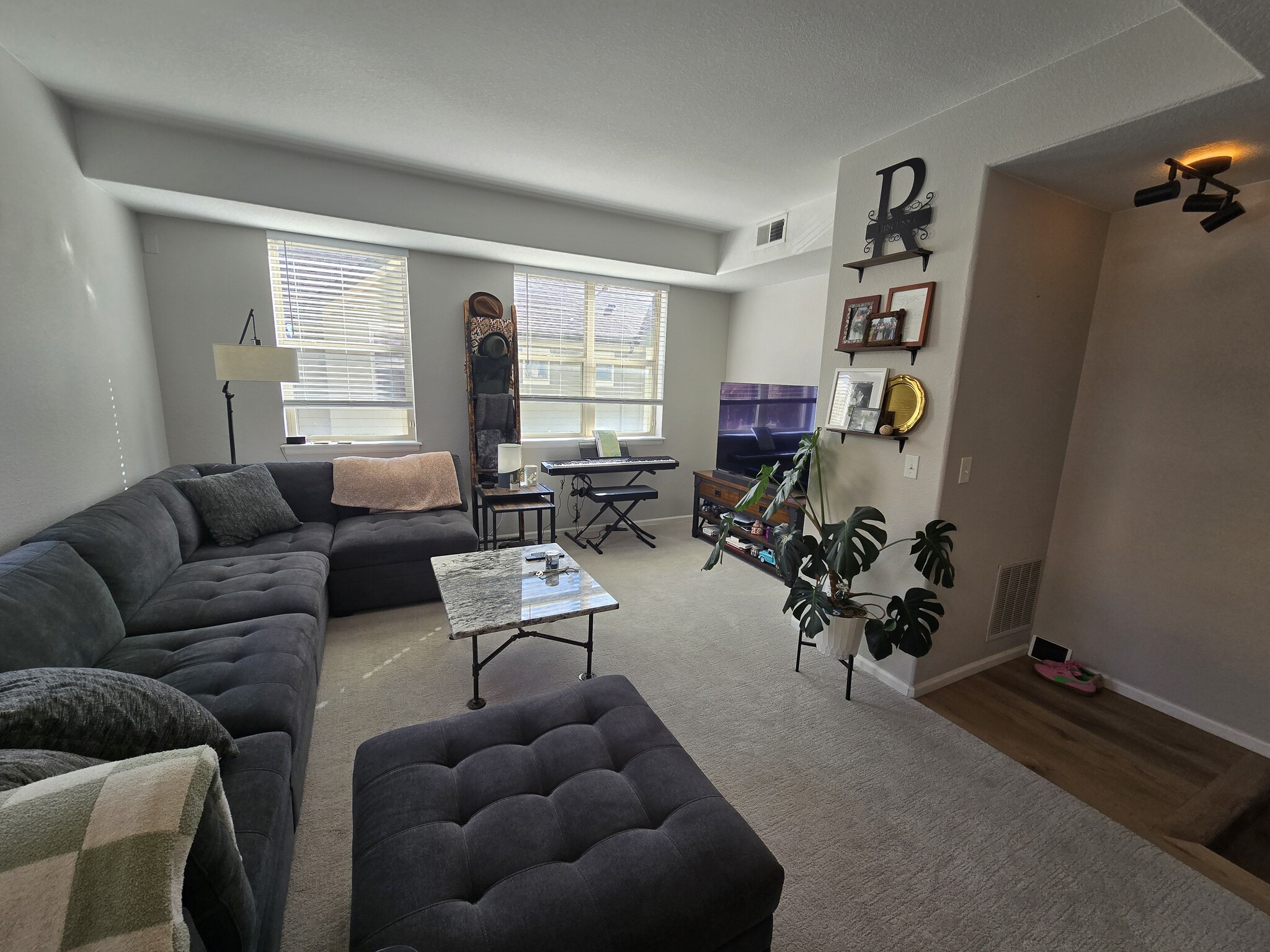 Living room with ample space and lots of corner windows! - 5498 Zephyr Ct