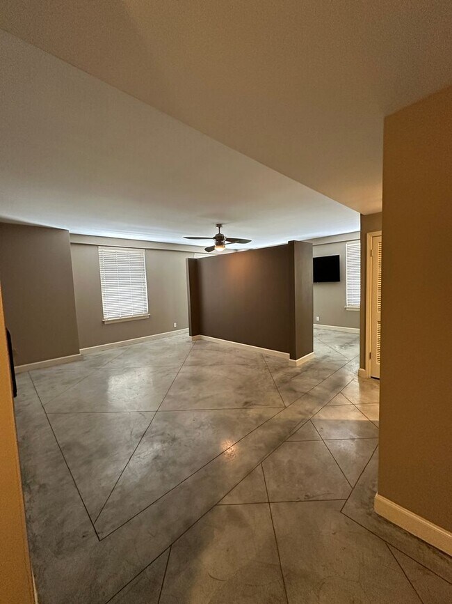 Building Photo - INCLUDES GARAGE PARKING AND INDOOR POOL! 1...