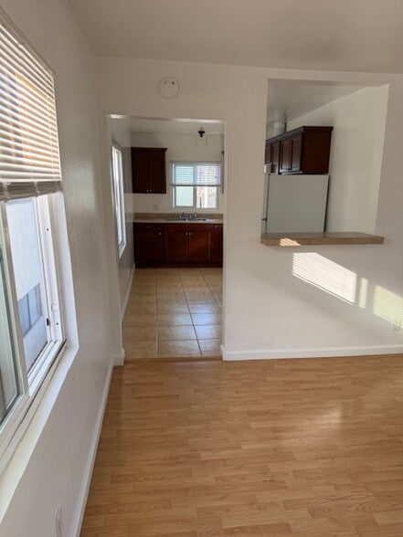 large kitchen that opens up to living room. - 4626 E 7th St