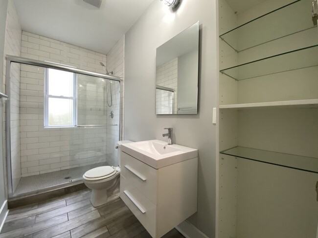 Updated bathroom with a step in shower with glass doors - 2 Bedroom - 2128 N Sawyer