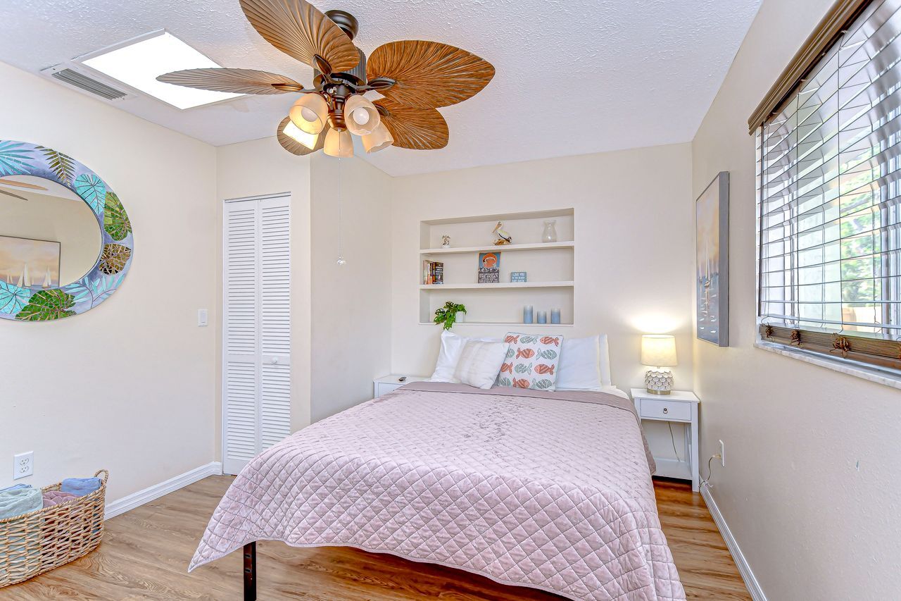 The bedroom features a queen bed, a 40" smart tv, walk in closet and dresser. - 5114 33rd St E