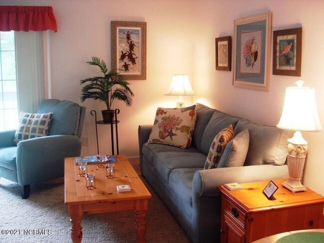 Building Photo - FULLY FURNISHED CONDO in sought-after Sea Trail subdivision!