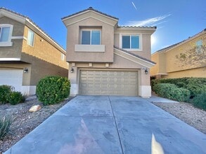 Building Photo - STUNNING 2 STORY HOME IN A GUARD GATED COM...