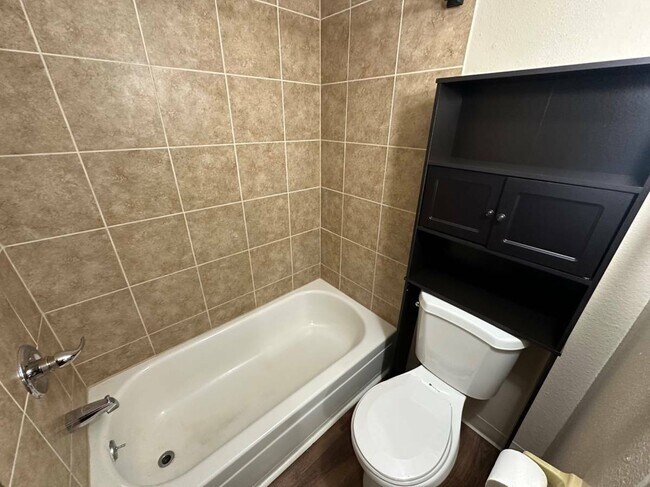 Experience luxury with this contemporary bathroom layout featuring sleek tiles and efficient storage. - Country Club