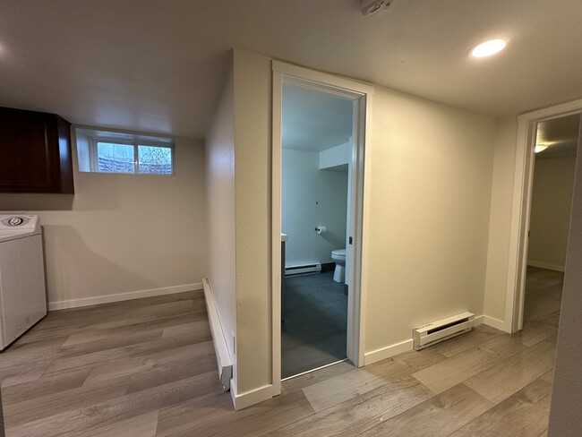 Bathroom and hallway to 1 bedroom - 1137 E Platte Ave