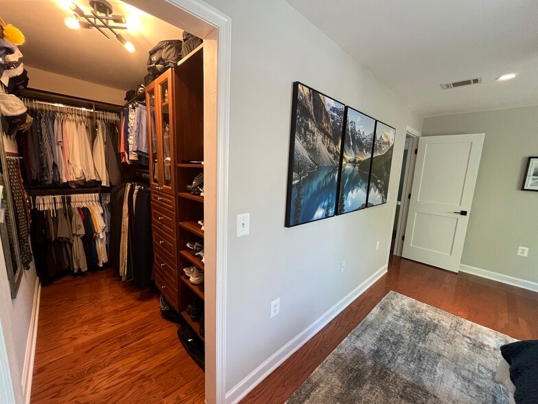 Bedroom view leading to the custom closet. - 4079 S Four Mile Run Dr