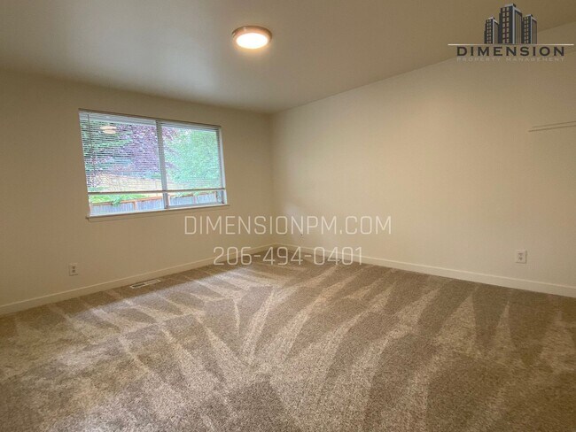 Building Photo - Stylishly Renovated Home with Private Back...