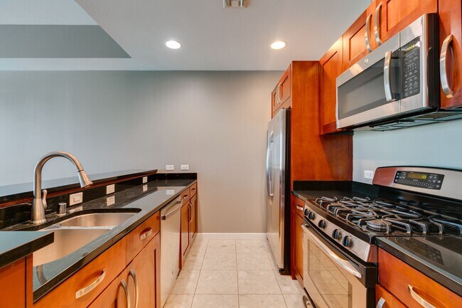 Building Photo - Iconic Strip-View Luxury | Elegant 1BR + Den High-Rise Residence