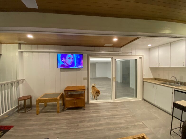 Patio, looking at living room entrance. Smart TV included. TV sound can play throughout house. - 3716 Claudine St