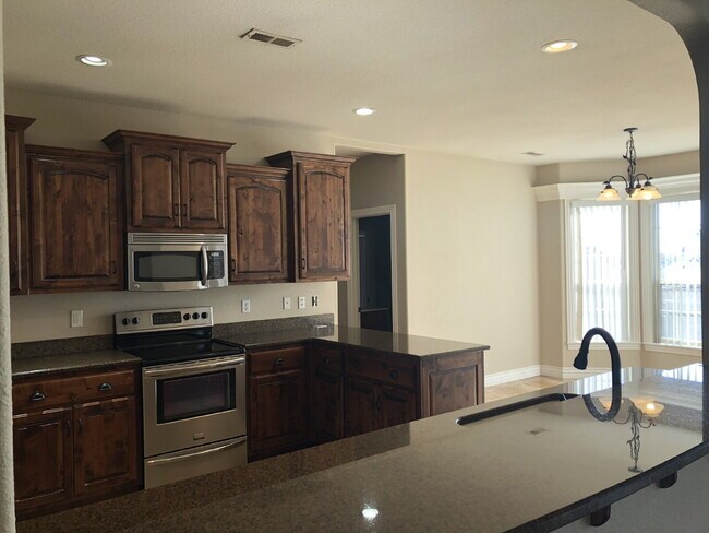 Building Photo - 4BR / 3Car garage / Fully fenced in backyard - Stunning property