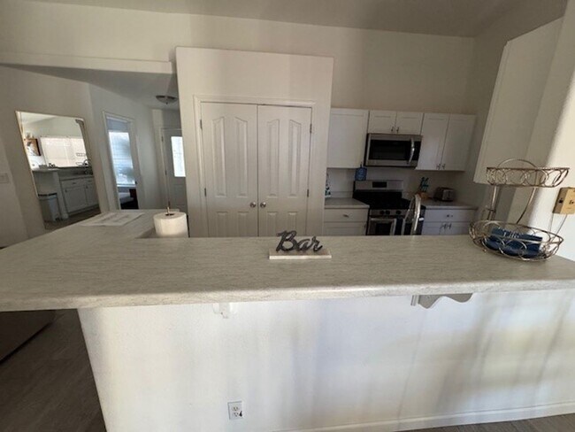 Building Photo - Pool Home with 3Bedrooms +Bonus Room Bullhead Parkway-Desert Foothills Estates- Can Be "Furnished...