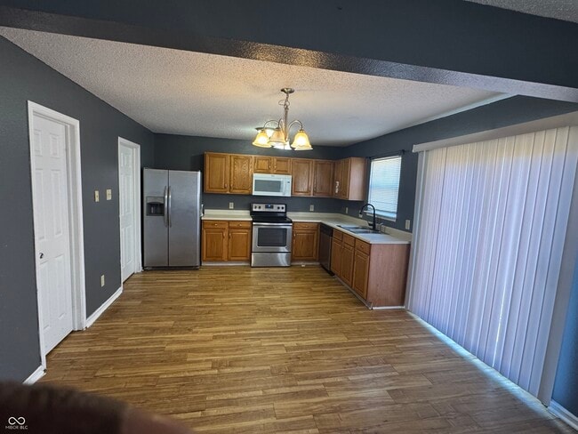 Building Photo - 9010 Orchid Bloom Pl