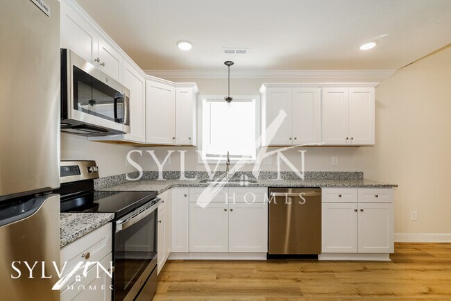 Building Photo - Lease today! No extra charge for contentme...
